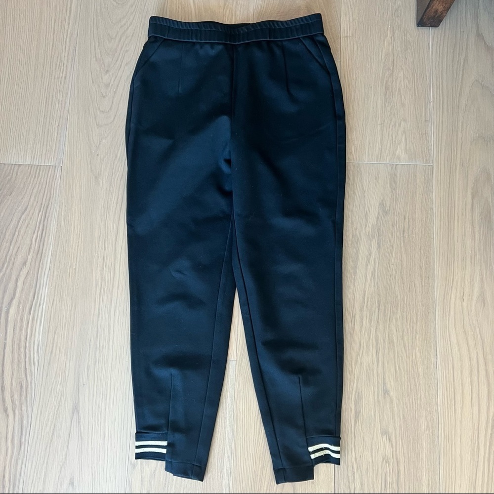 Black joggers asymmetrical bottom trim accent size large stretchy elastic